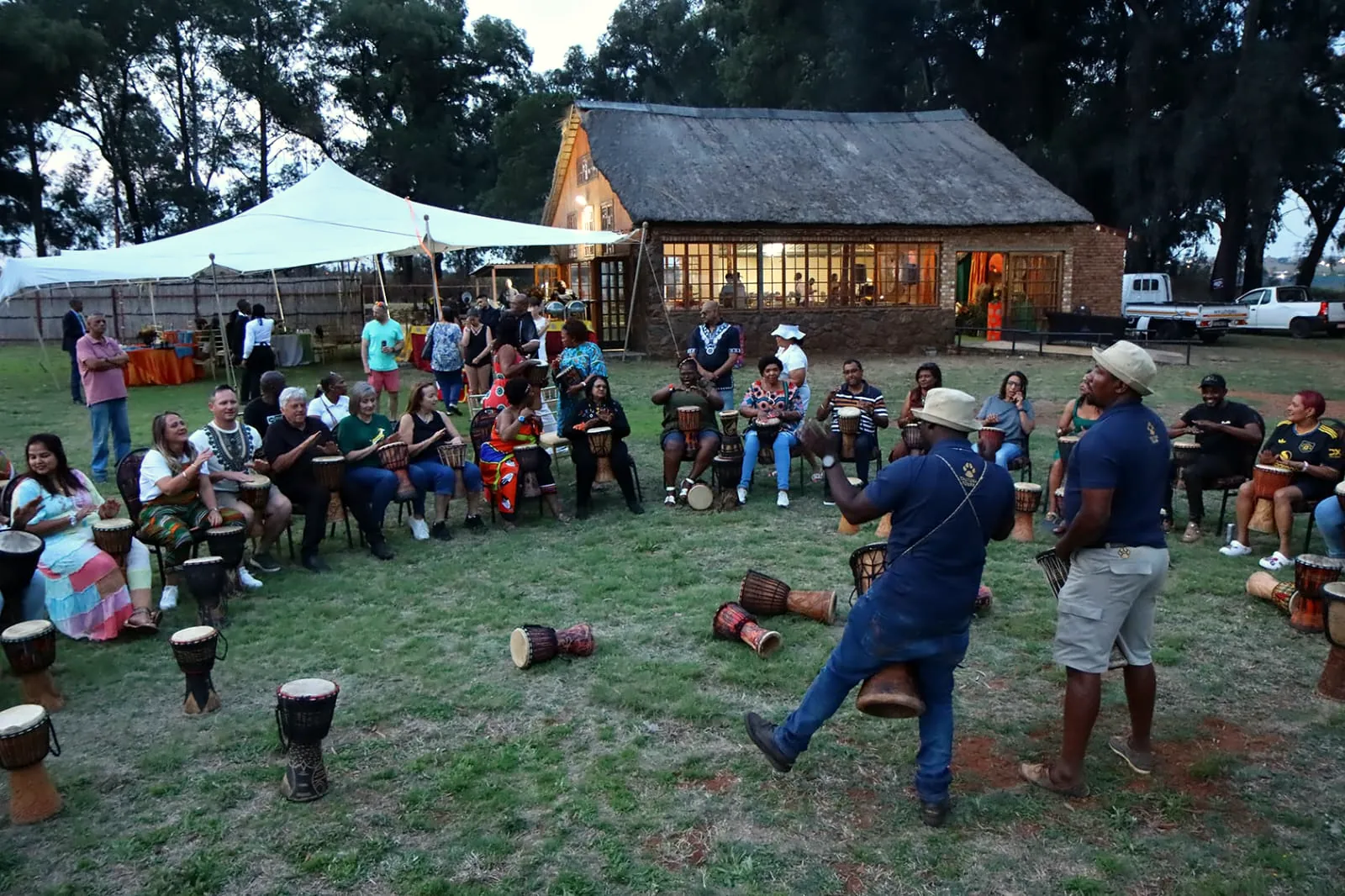 Interactive drumming circle on a lodge lawn