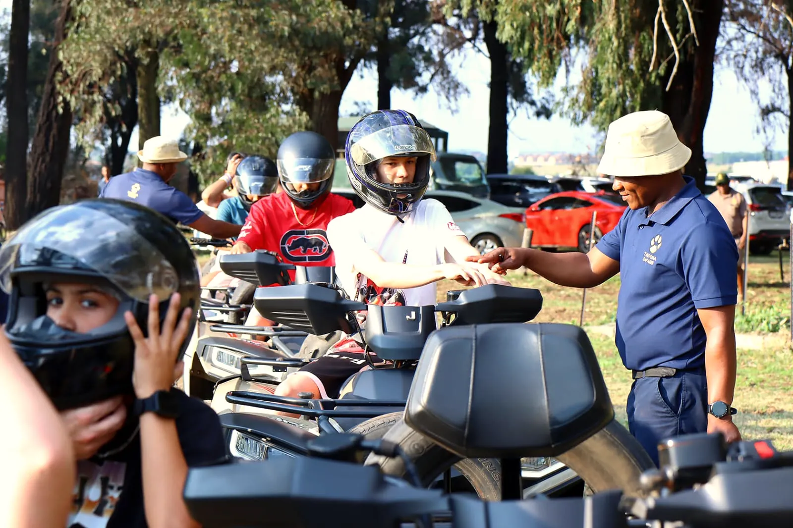 A Tautona guide briefing riders on their quad bikes before the trail