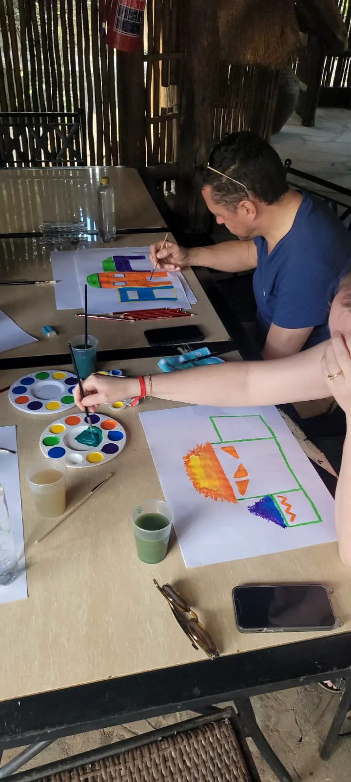 A team painting together at a creative team-building session