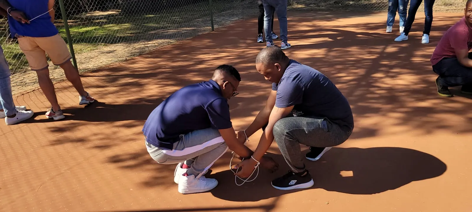 Partner challenge on red sand