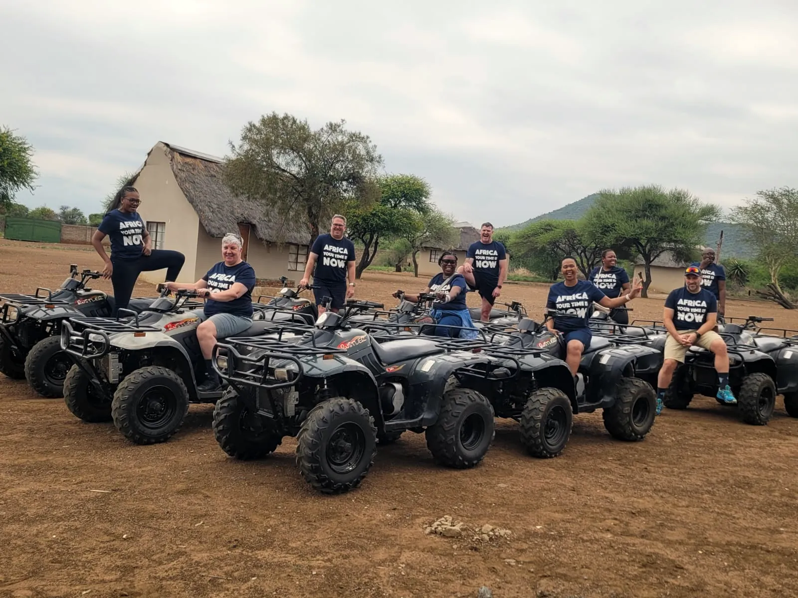 A team lined up on quad bikes