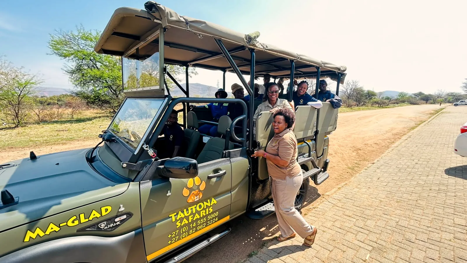 Guests boarding the open game vehicle