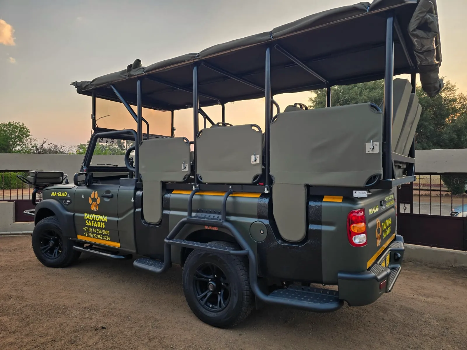 New open game-drive vehicle at sunset